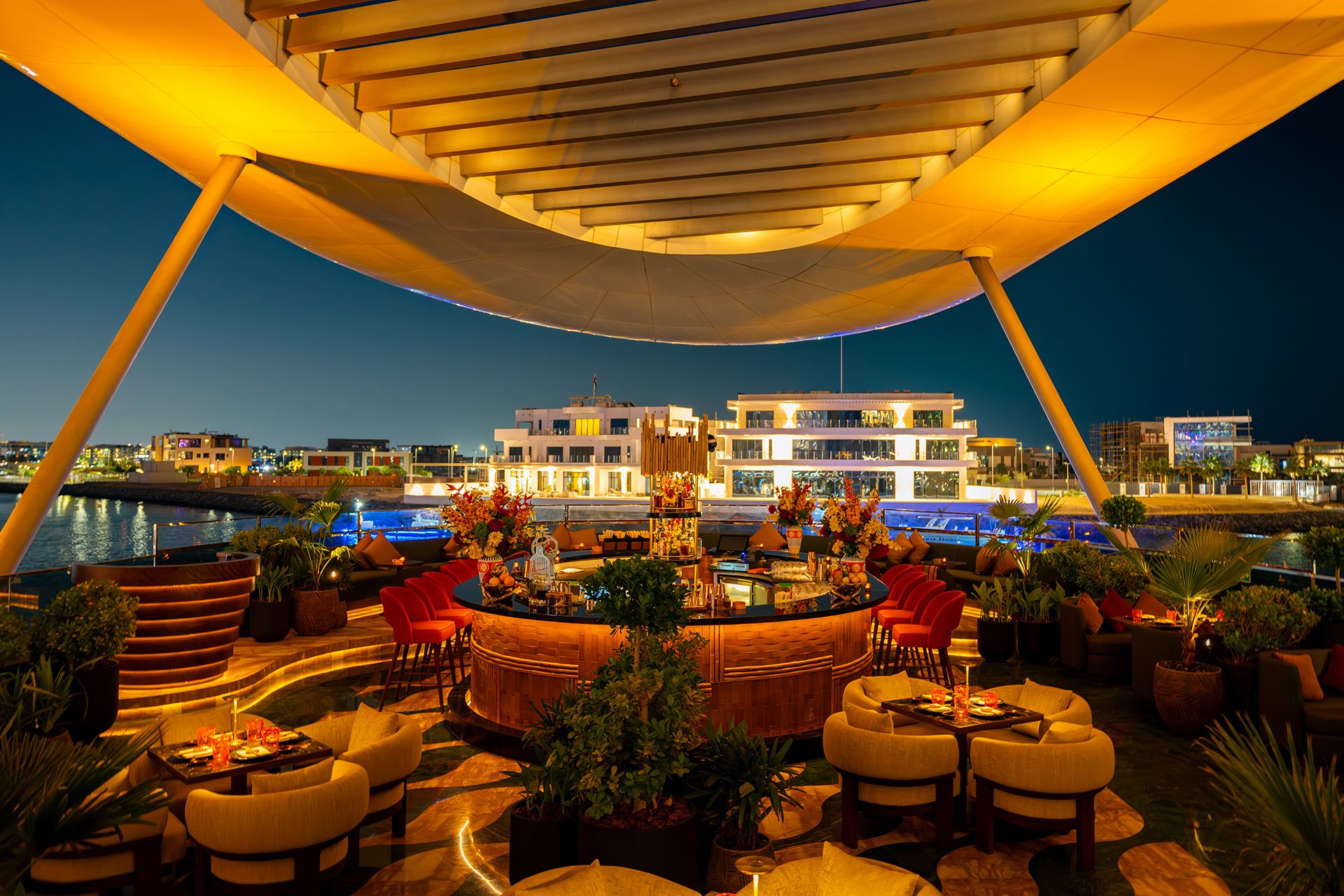 SUSHISAMBA Abu Dhabi terrace at night, featuring stunning views of the waterfront.