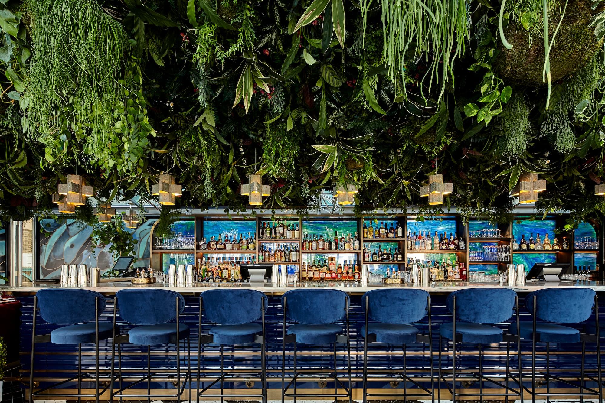Sushisamba Covent Garden bar with green canopy ceiling and navy chairs