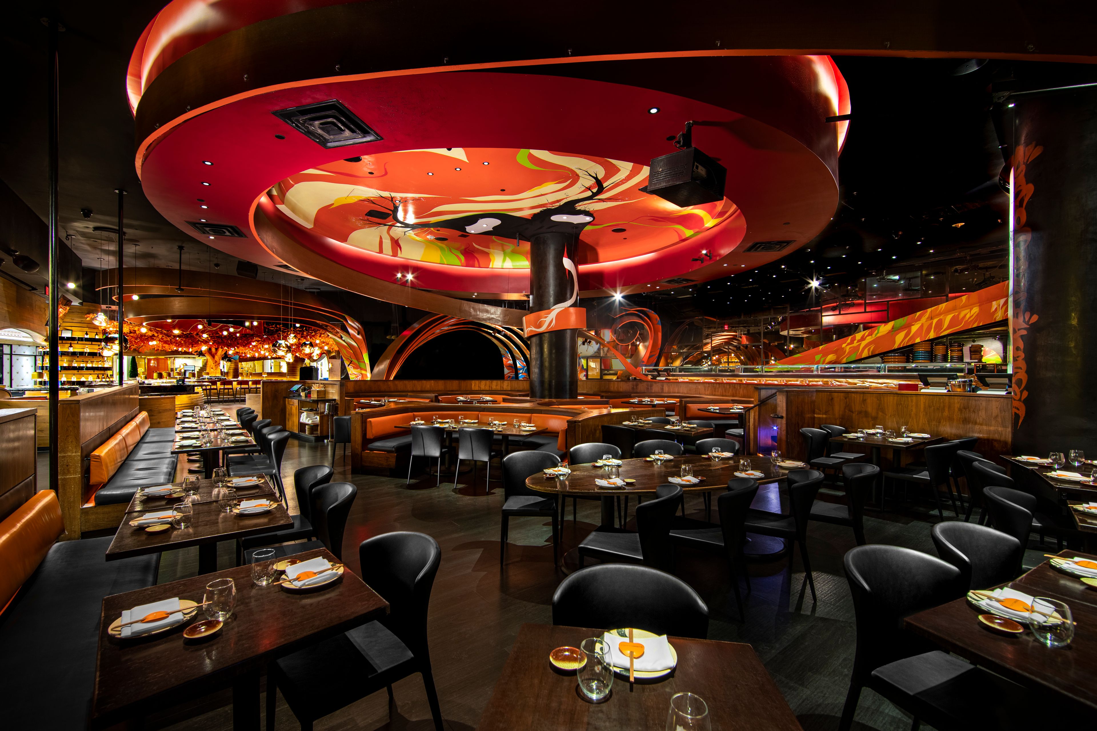 SUSHISAMBA Las Vegas dining room, with colorful graffiti ceiling