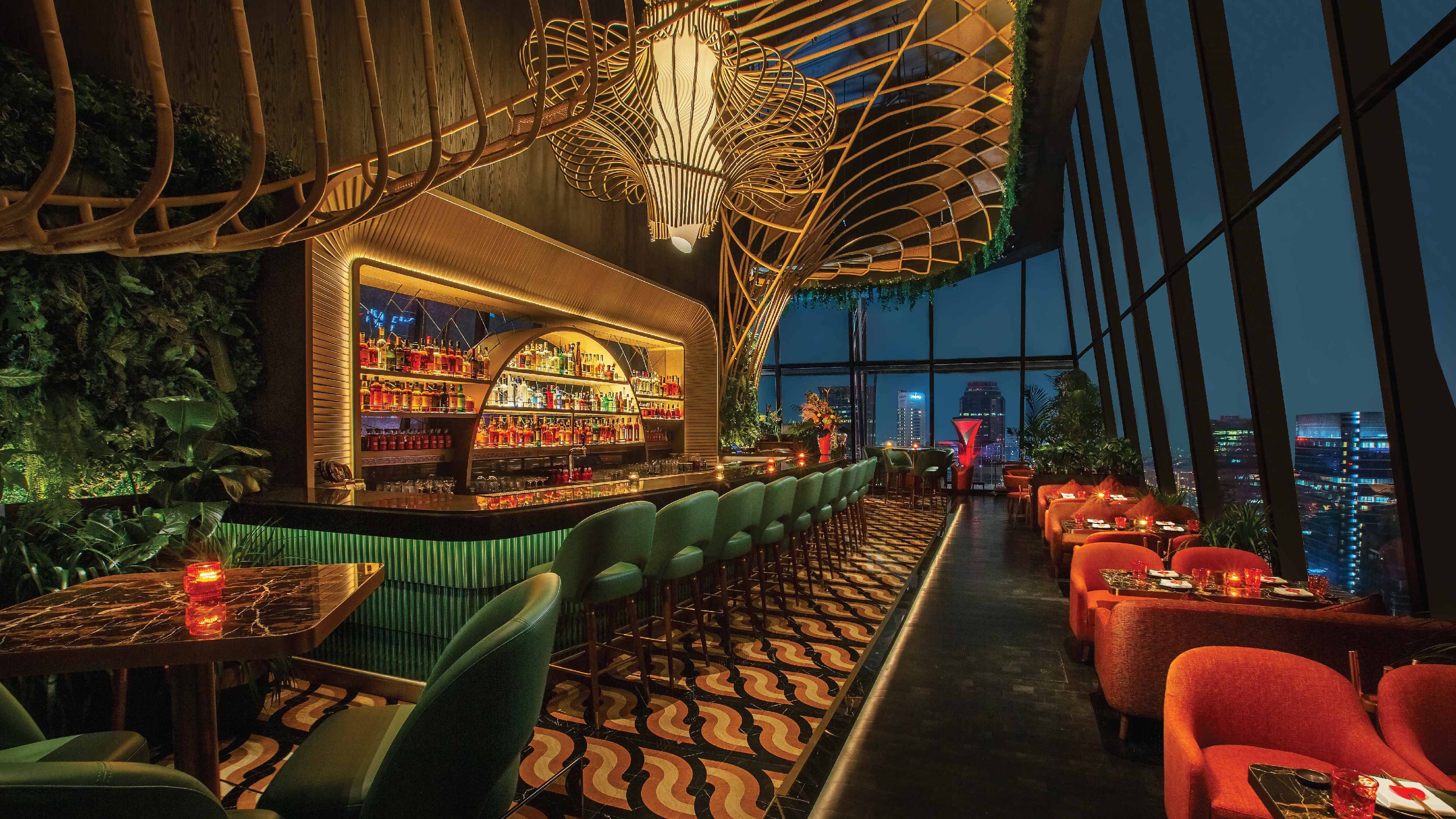 Experience the SUSHISAMBA Singapore bar at night, illuminated by an intricate geometric wooden ceiling installation, warm amber lighting, and views of the city skyline.
