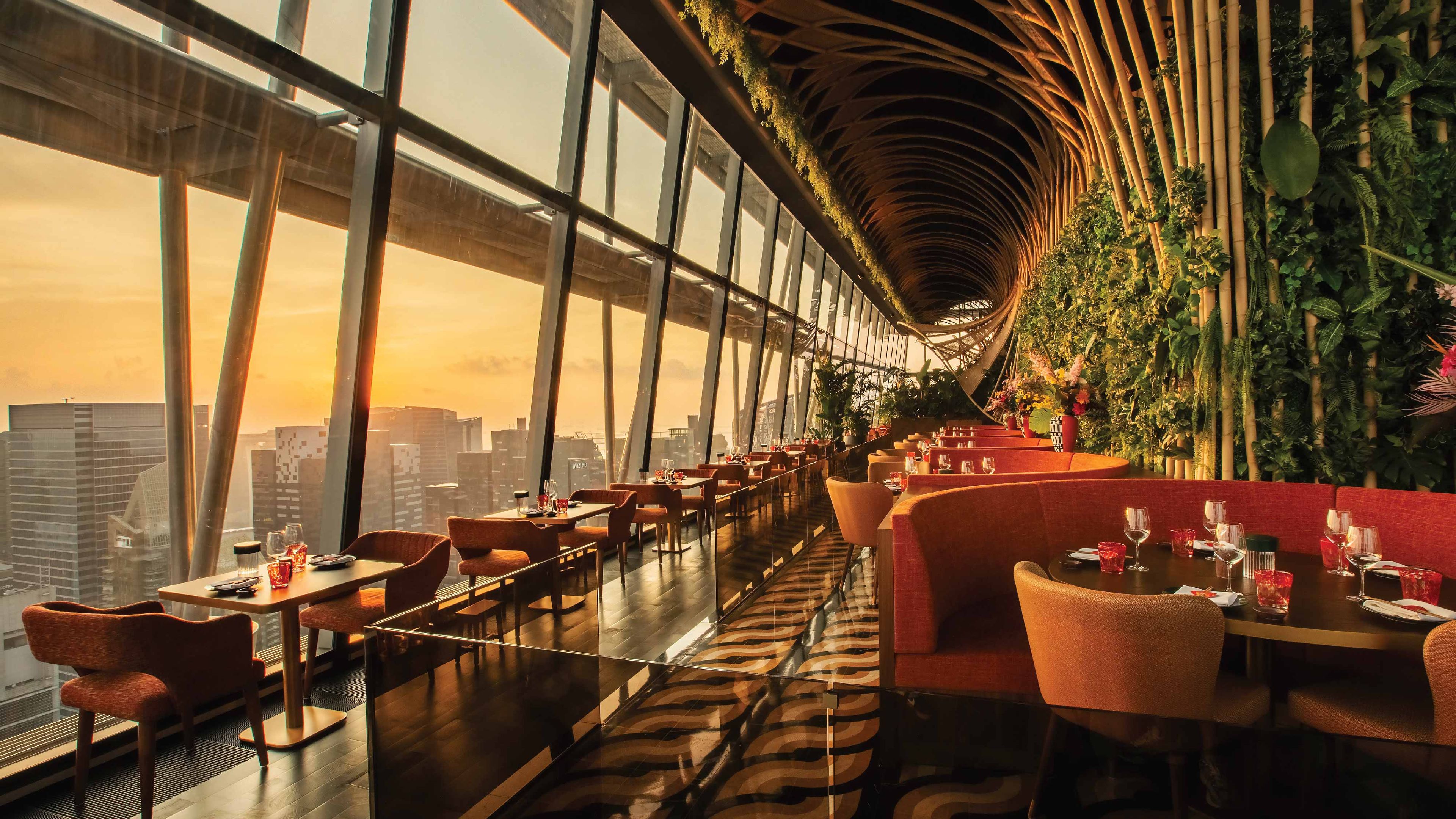 Experience SUSHISAMBA SINGAPORE dining room with a skyline view