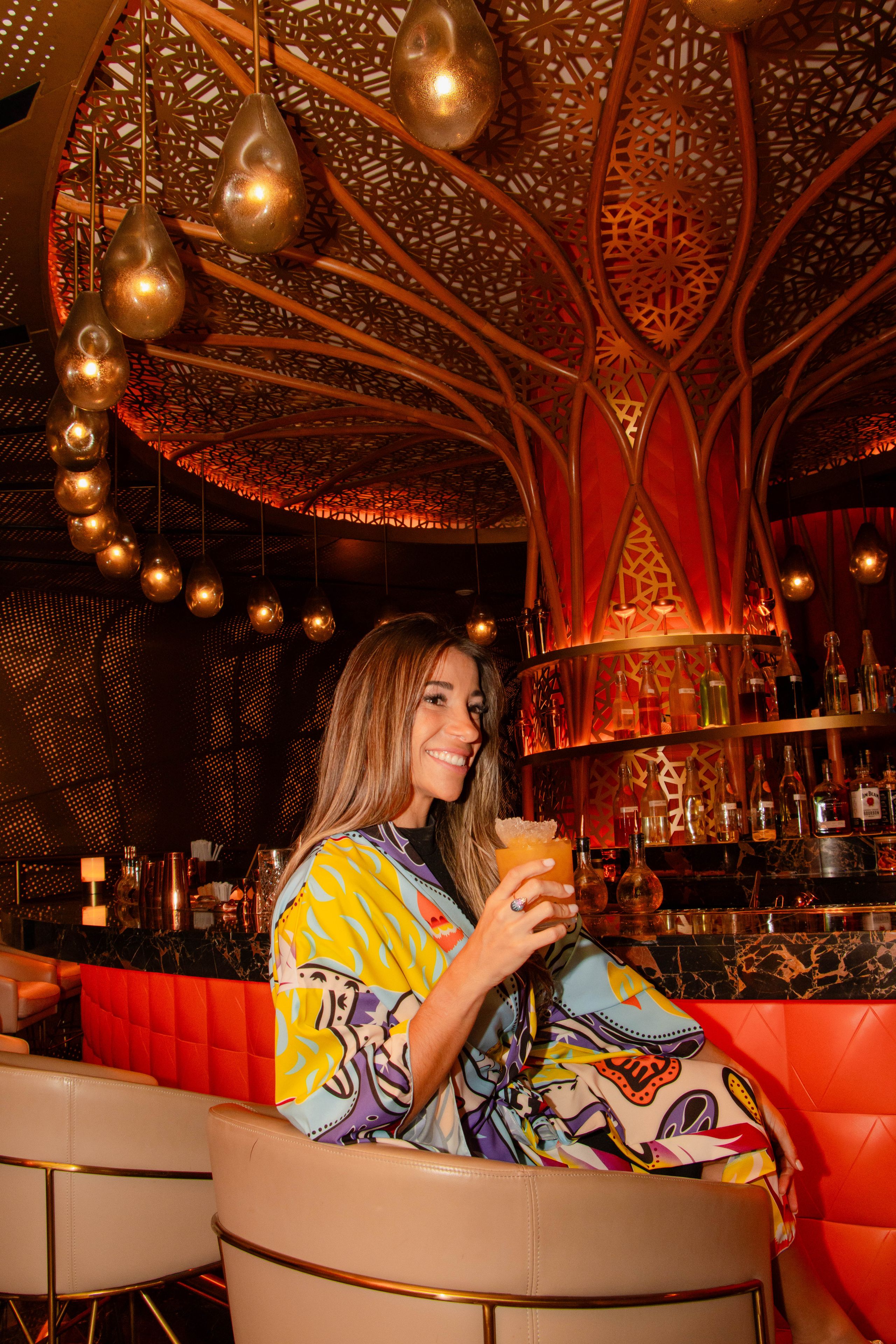 SUSHISAMBA Doha lady with cocktail at the bar