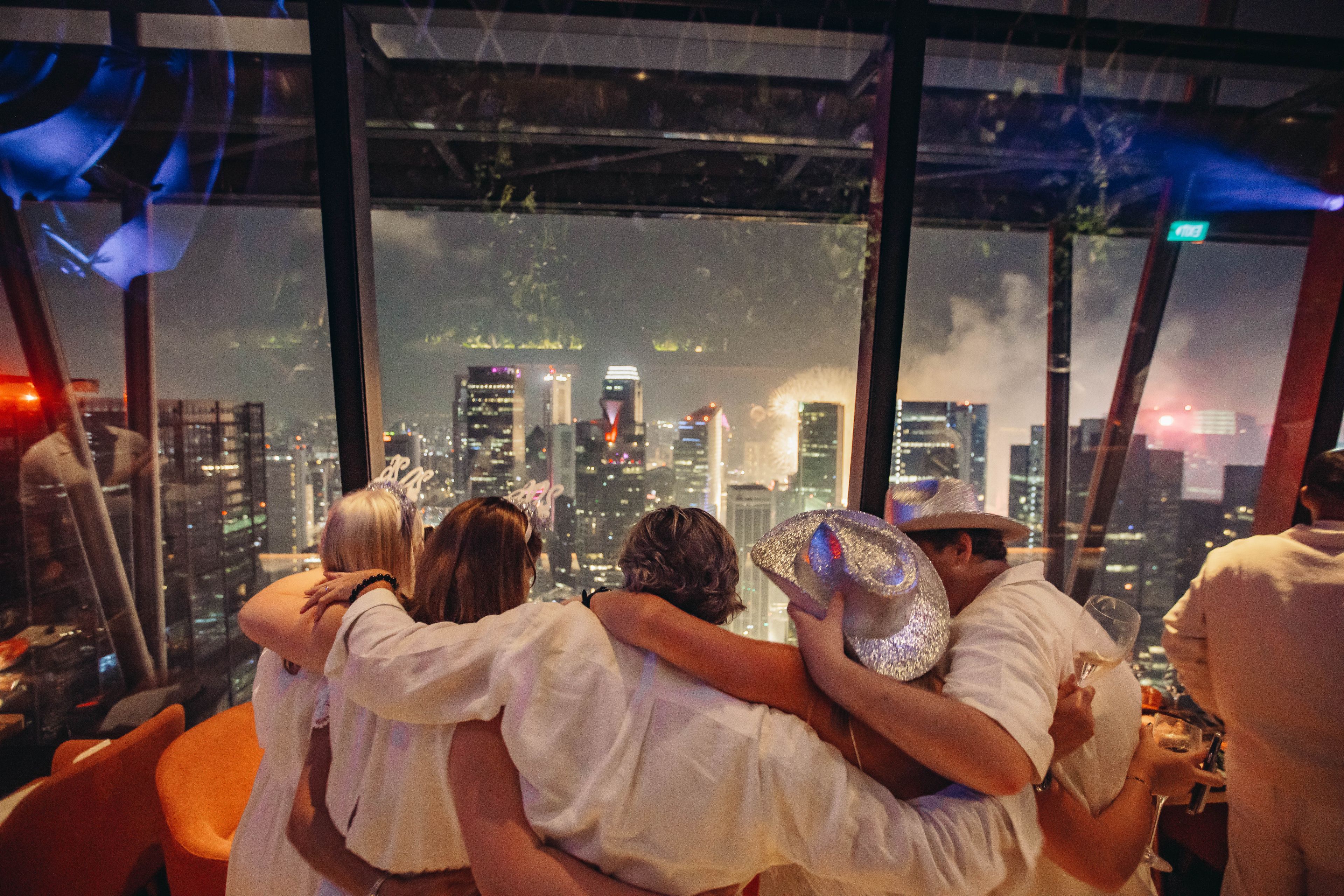 SUSHISAMBA Singapore guests in all white watching the fireworks